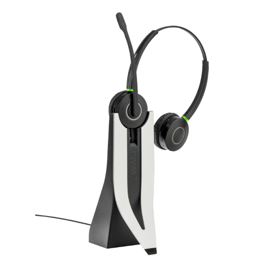 Wildix DuoLED wireless headset with boom microphone, resting on its charging stand against a white background.