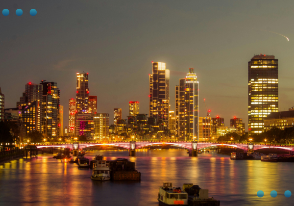 Captivating Night View of London Skyline
A nighttime panoramic view of the illuminated London skyline, featuring a bridge crossing the Thames River with bright city lights reflecting on the water.