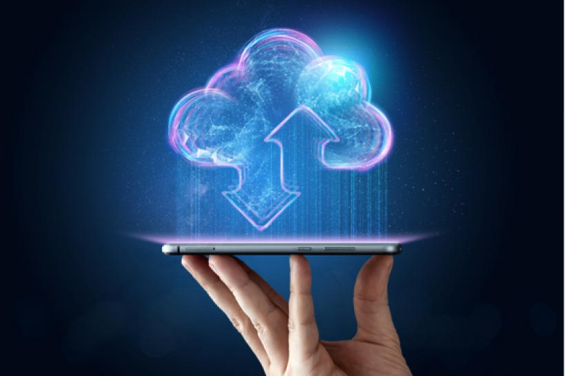Cloud graphic with an arrow pointing up from a tablet