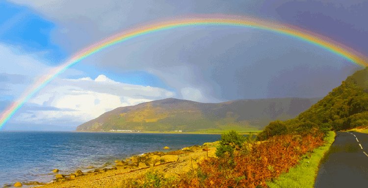 A rainbow over water A rainbow over water
