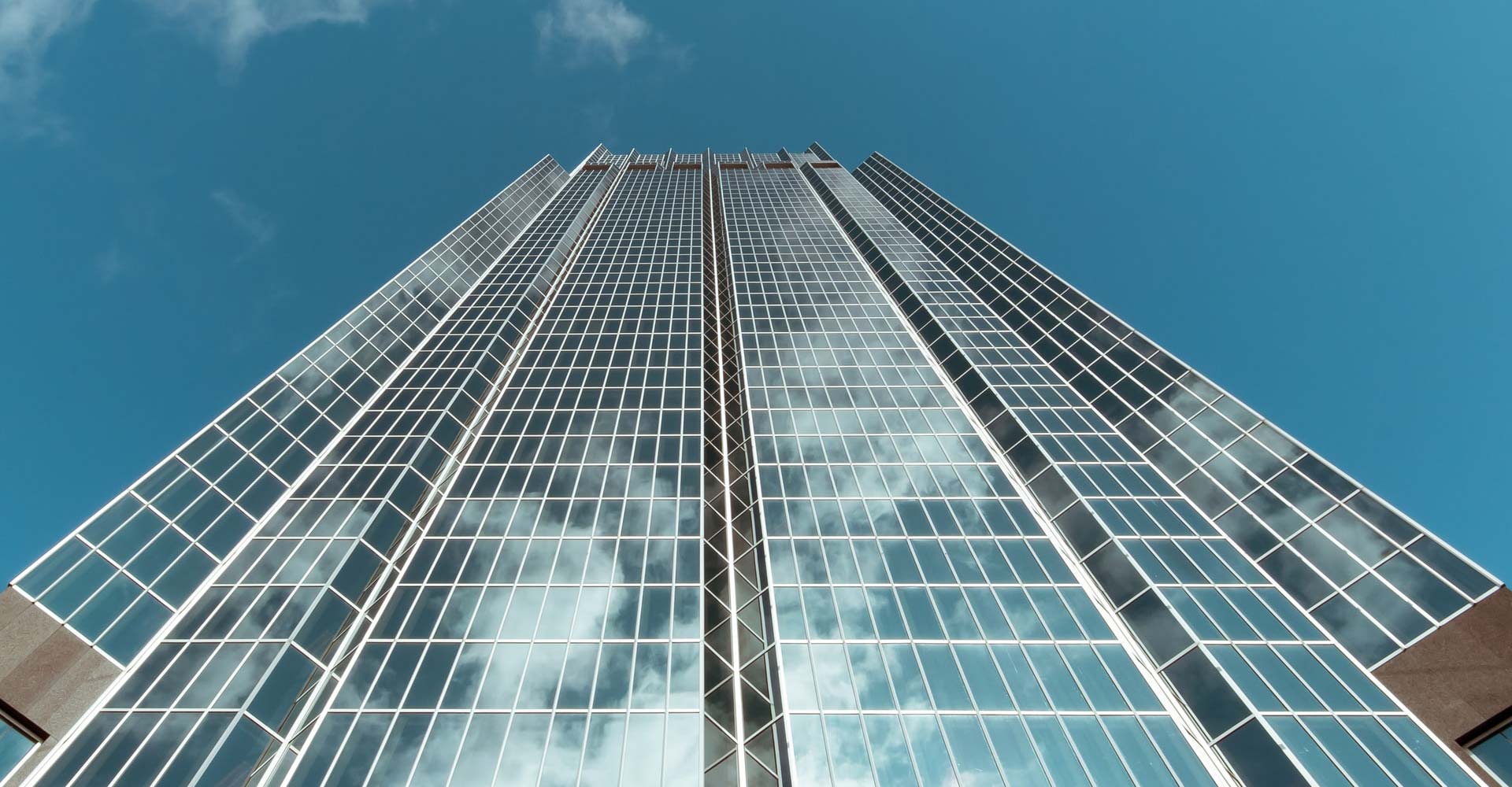 A London skyscraper against a clear blue sky