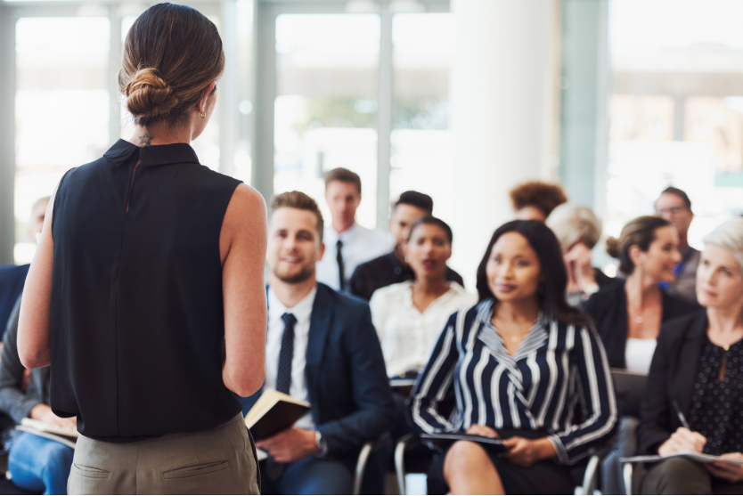 A women training a room of people